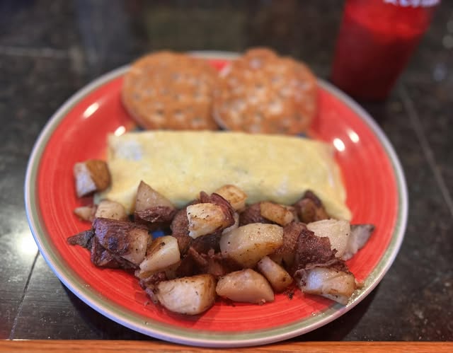 The Spicy Pig breakfast special with ham, bacon, chorizos, jalapeños, and pepper jack cheese